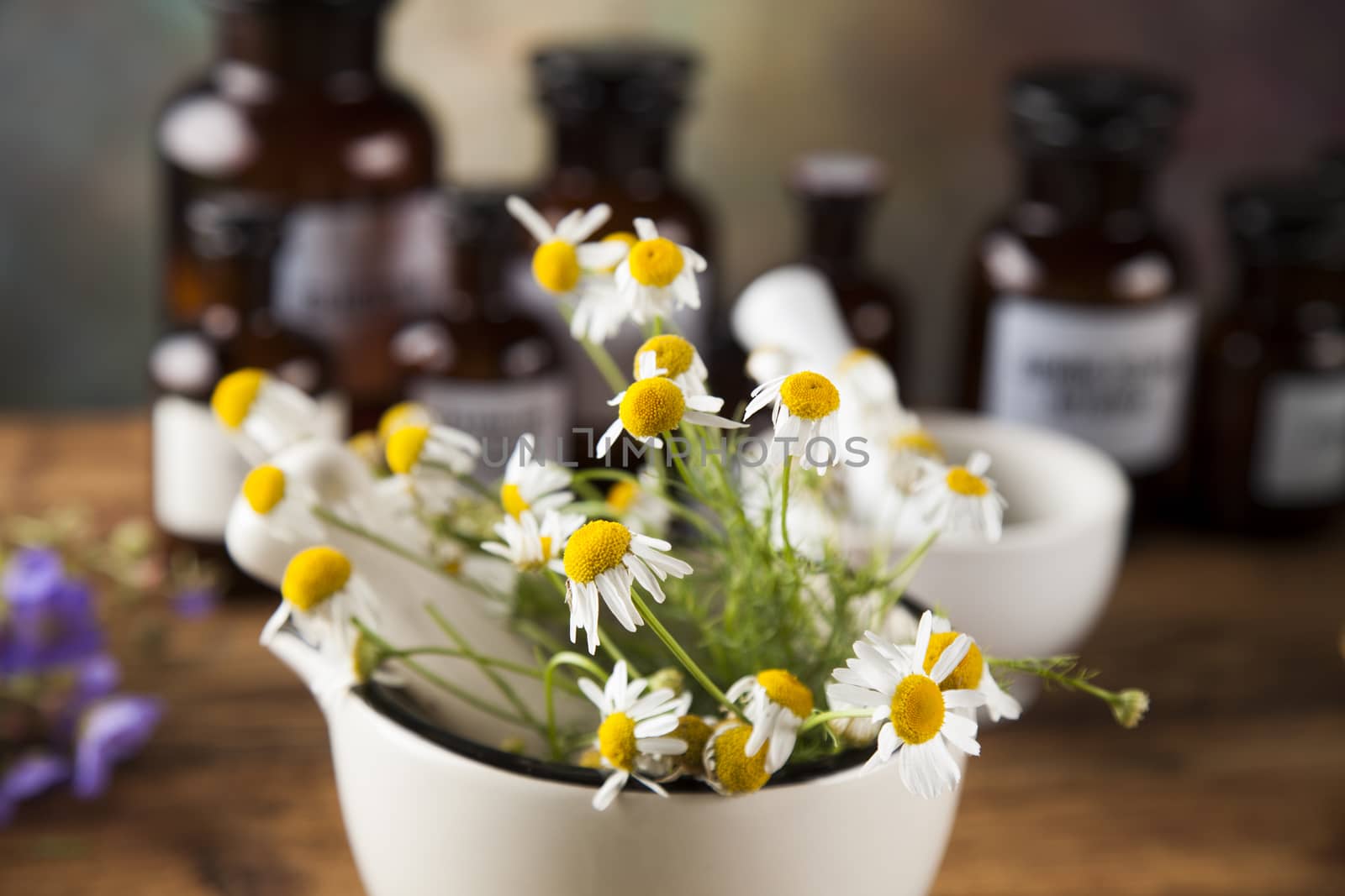 Natural medicine, herbs, mortar on wooden table background by JanPietruszka