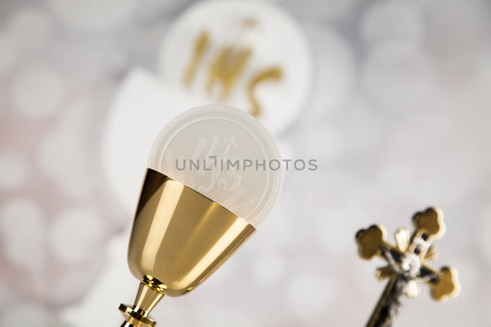 Holy communion a golden chalice, composition isolated on white