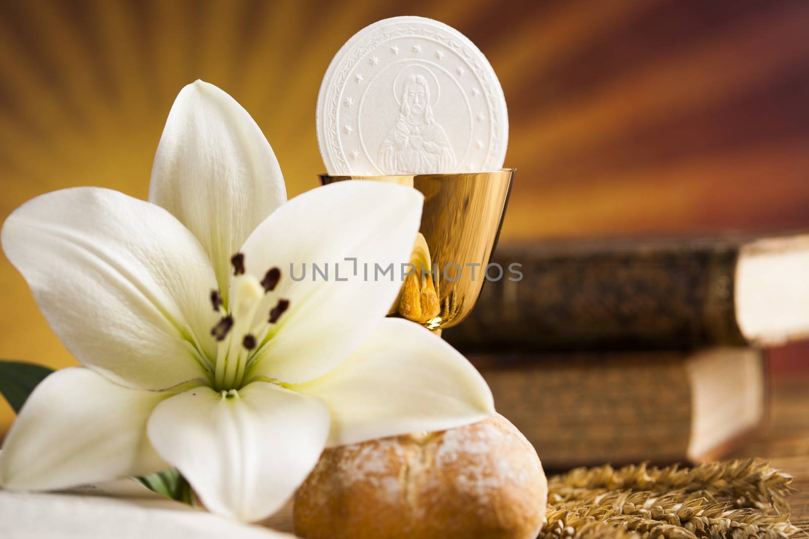 Holy communion a golden chalice with grapes and bread wafers