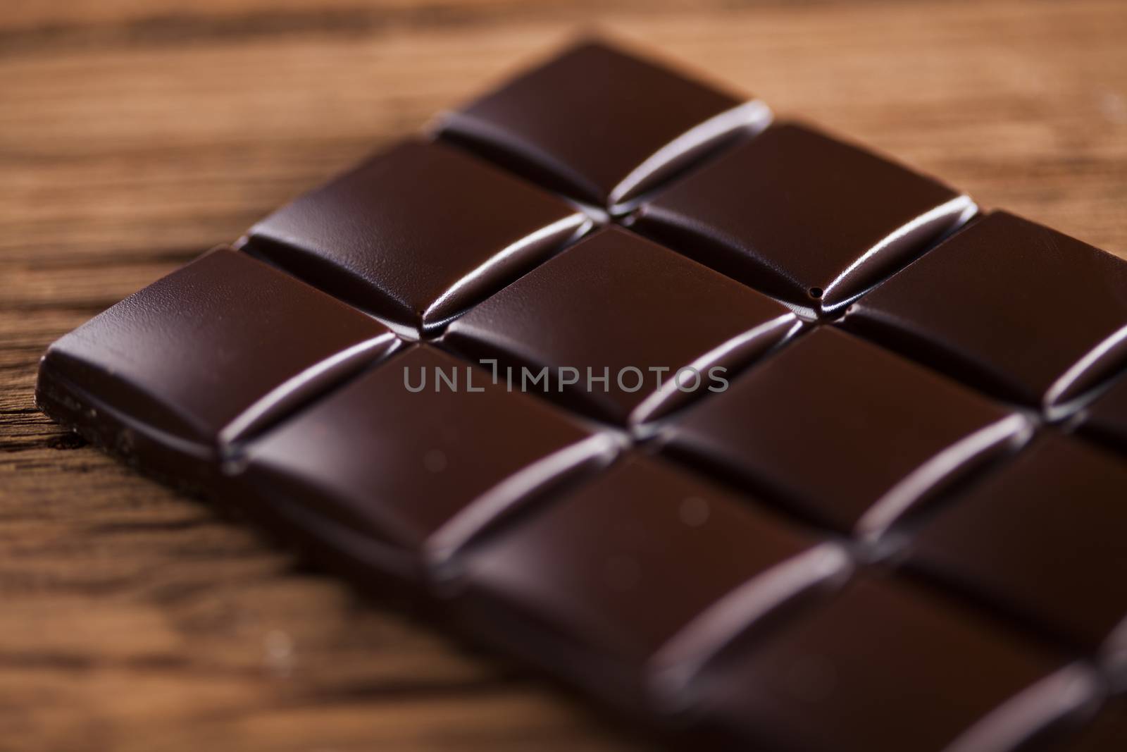 Chocolate bar, candy sweet, dessert food on wooden background by JanPietruszka