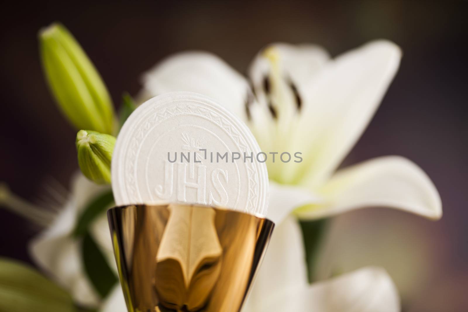 Holy communion a golden chalice with grapes and bread wafers by JanPietruszka