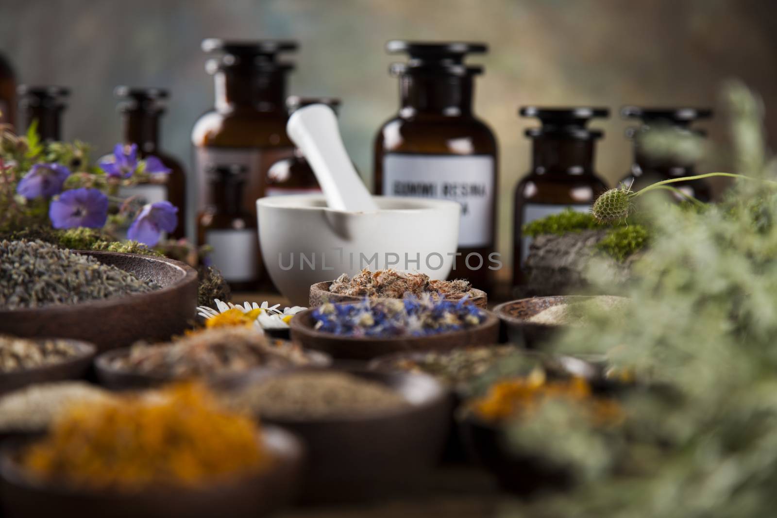 Herbal medicine on wooden desk background by JanPietruszka