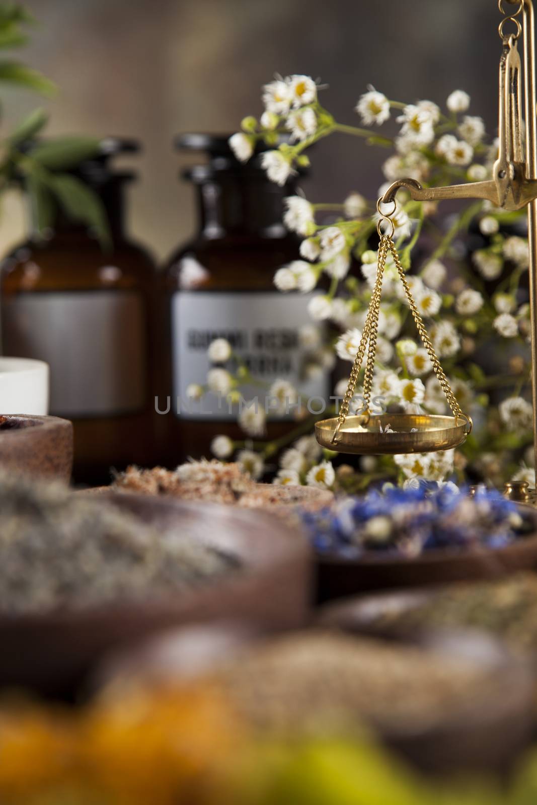 Natural medicine, herbs, mortar on wooden table background