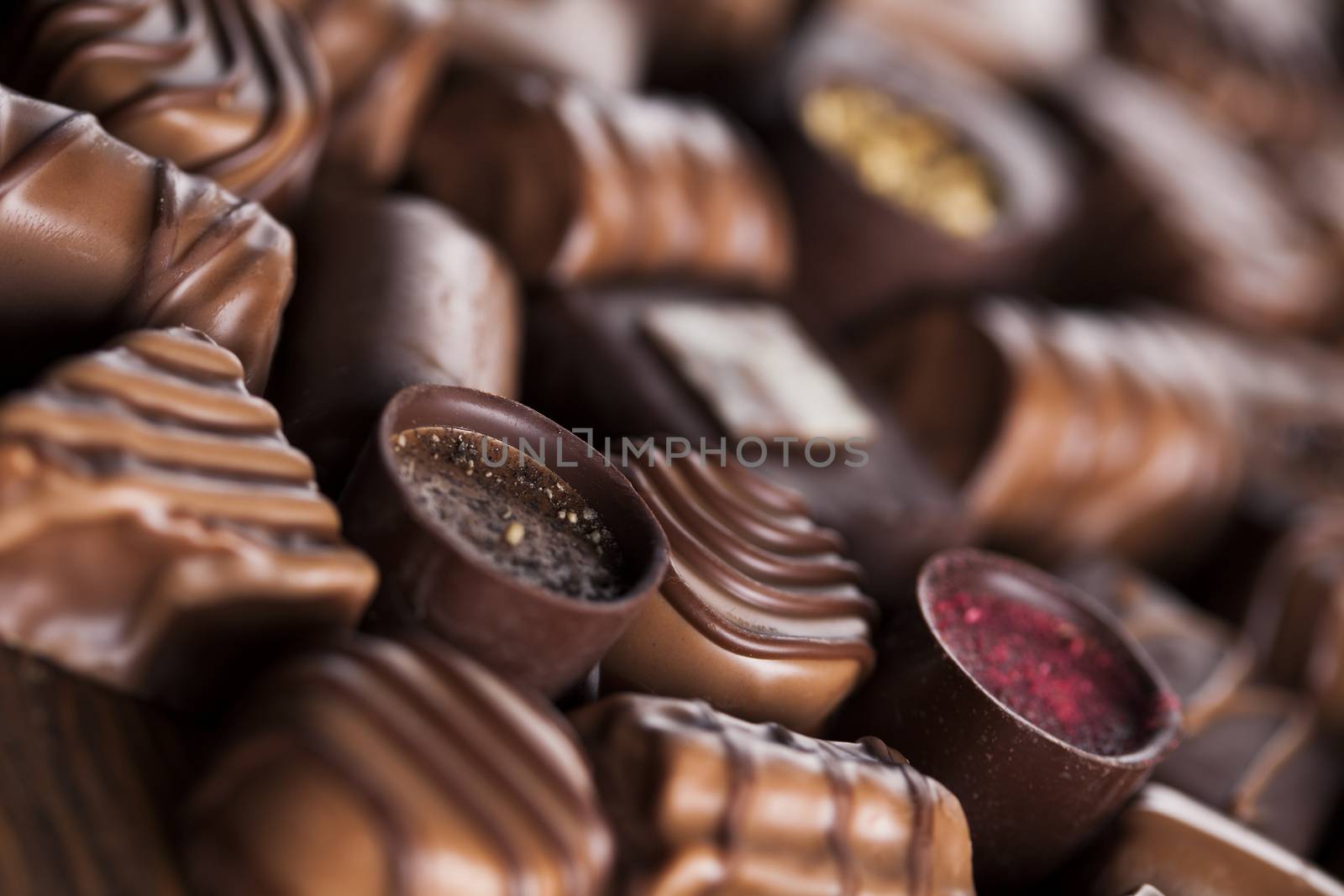 Praline Chocolate on wooden backgroud by JanPietruszka