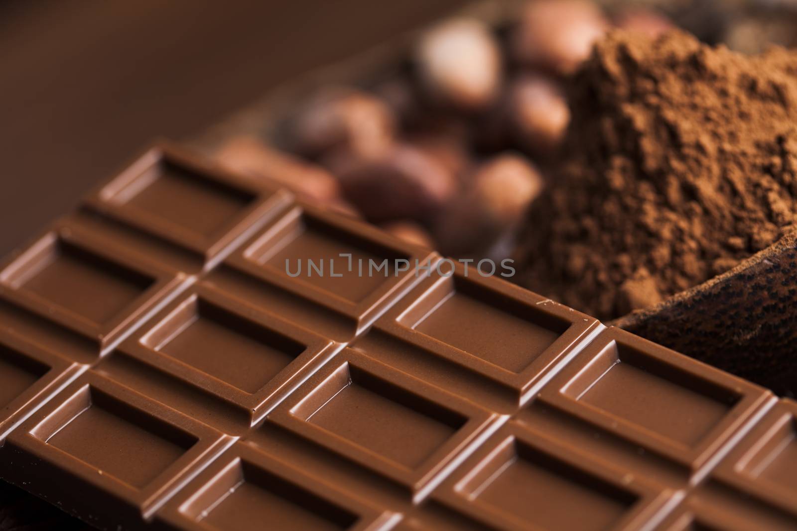 Cocoa pod and chocolate bar and food dessert background by JanPietruszka