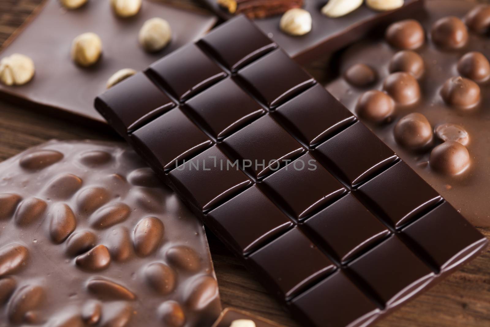 Dark and milk chocolate bar on a wooden table