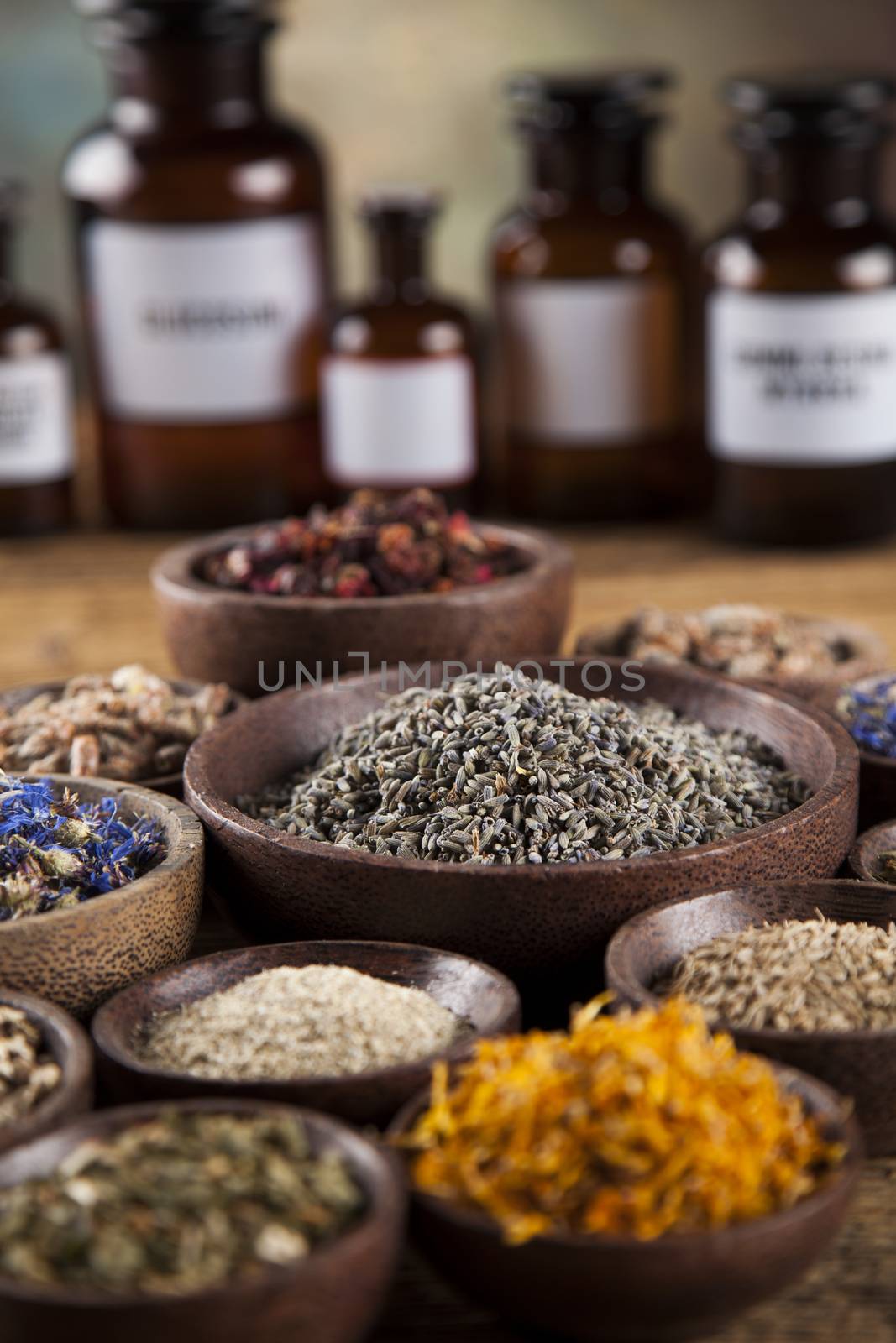 Herbs medicine and vintage wooden desk background by JanPietruszka