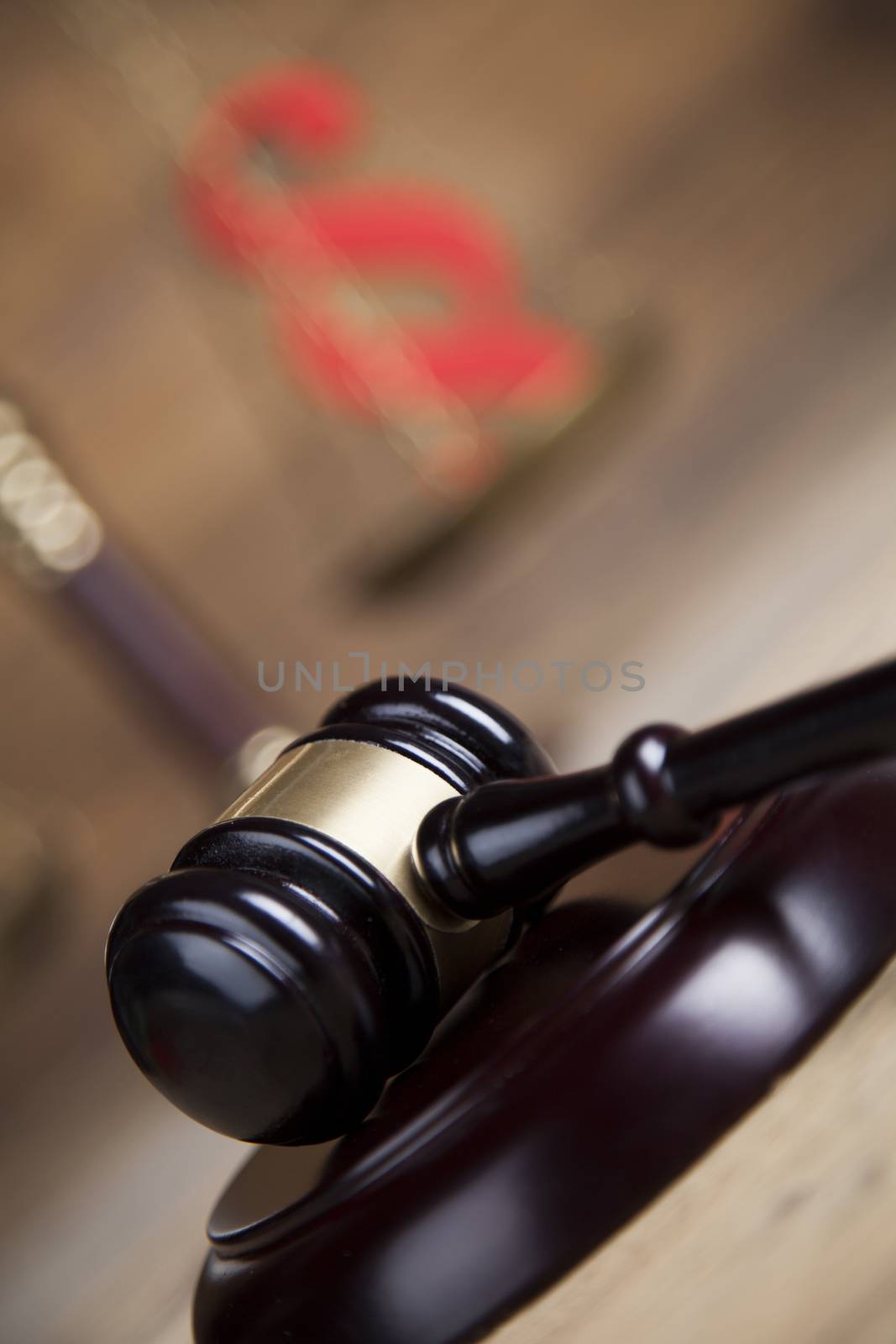 Law theme, mallet of the judge, wooden desk background by JanPietruszka