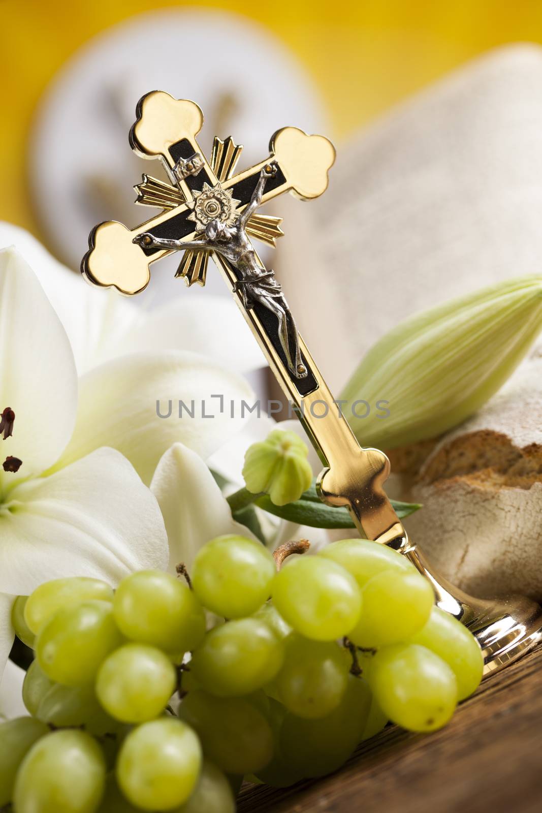 Holy communion a golden chalice with grapes and bread wafers by JanPietruszka