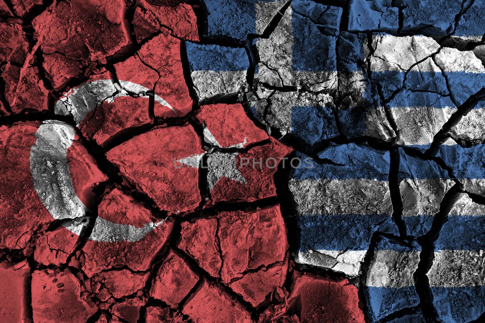 Turkey and Greece flag on cracked ground . Confliction and crisis concept . by stockdevil