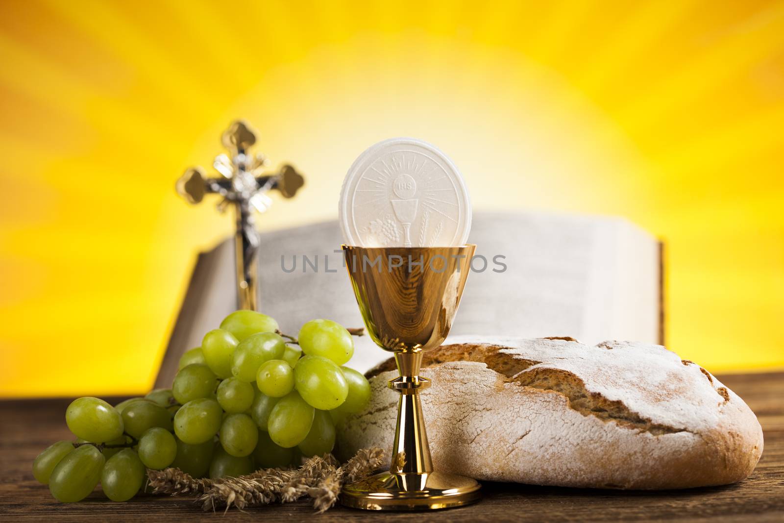 Symbol christianity religion a golden chalice with grapes and br by JanPietruszka