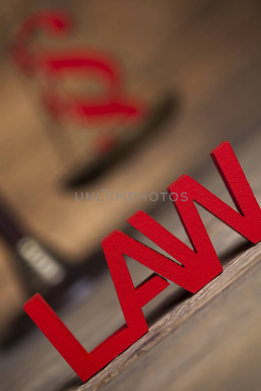 Law theme, mallet of the judge, justice scale, wooden desk background