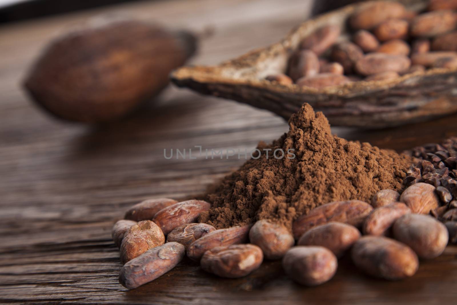 Cacao beans and powder and food dessert background by JanPietruszka