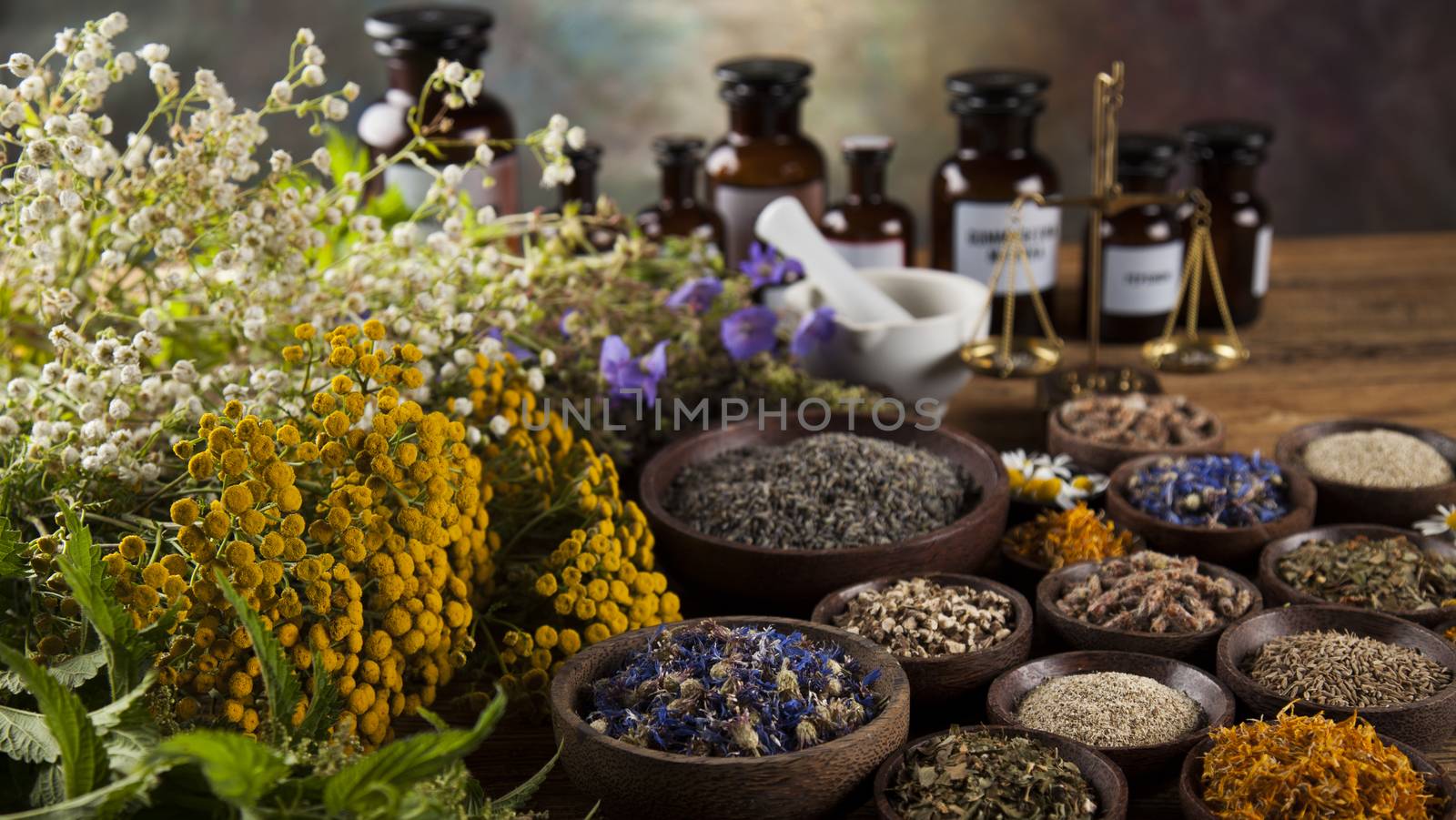 Herbal medicine on wooden desk background by JanPietruszka