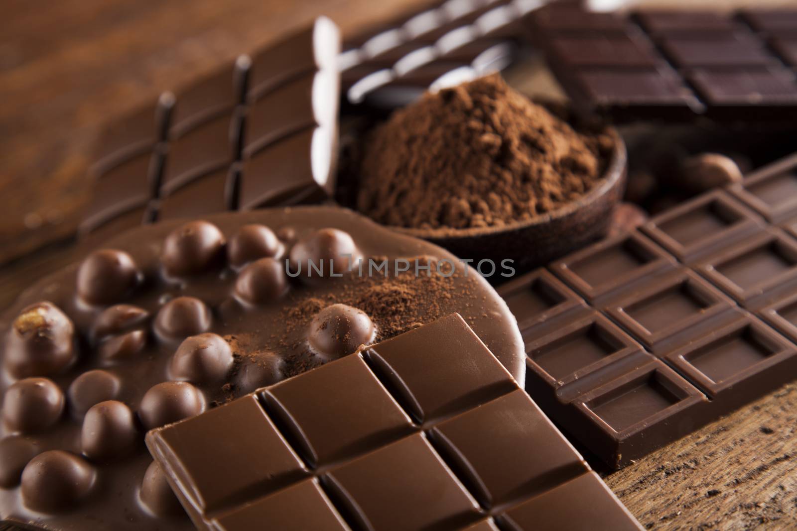 Chocolate bar, candy sweet, dessert food on wooden background by JanPietruszka