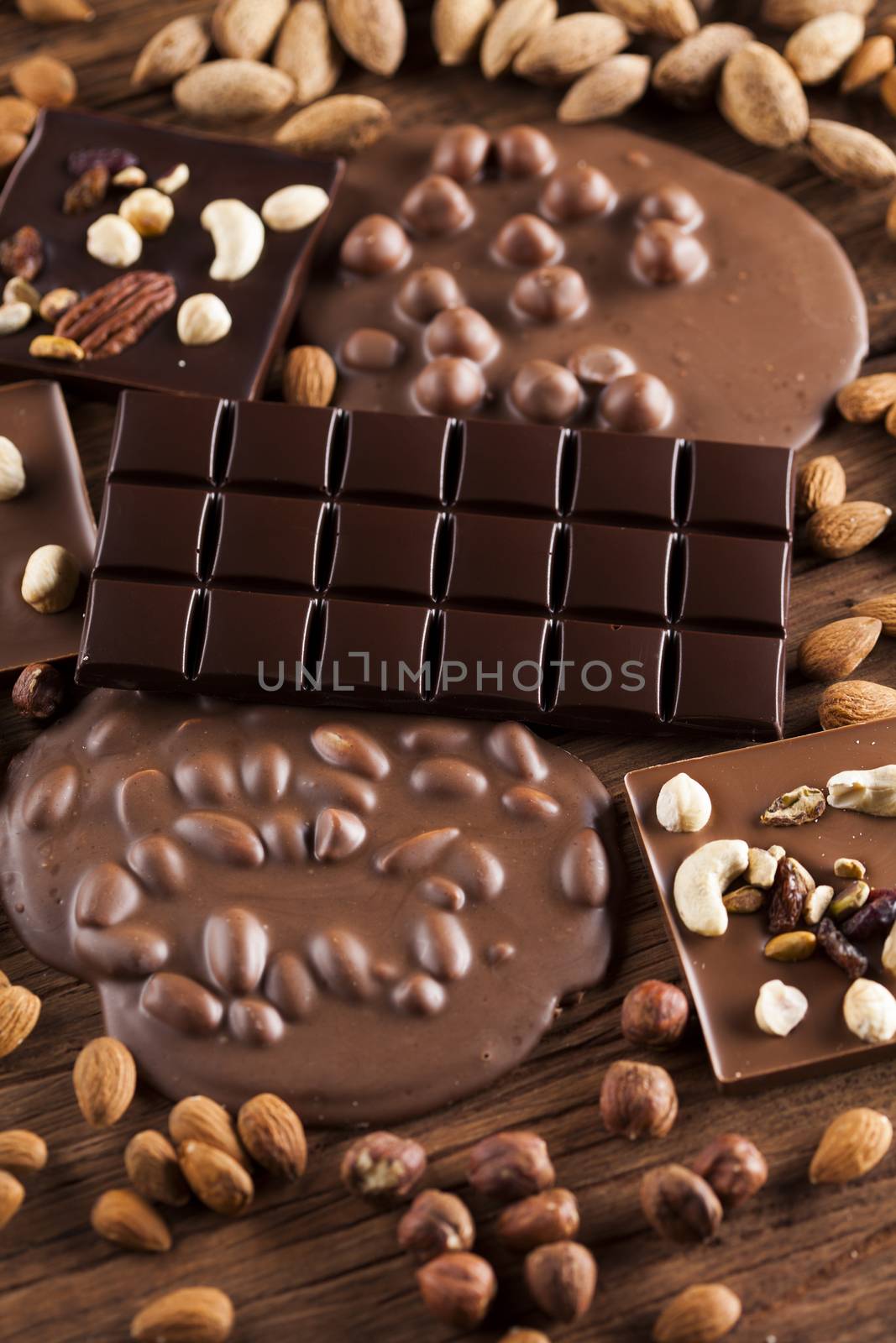 Dark and milk chocolate bar on a wooden table