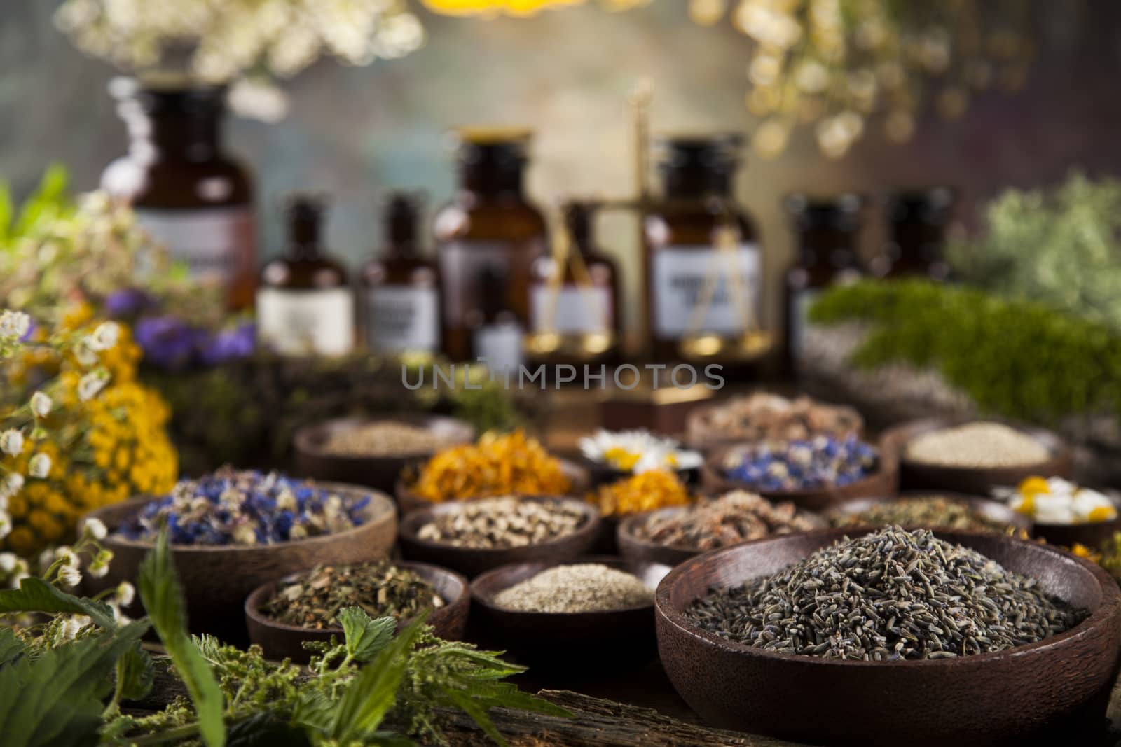 Natural medicine on wooden table background by JanPietruszka