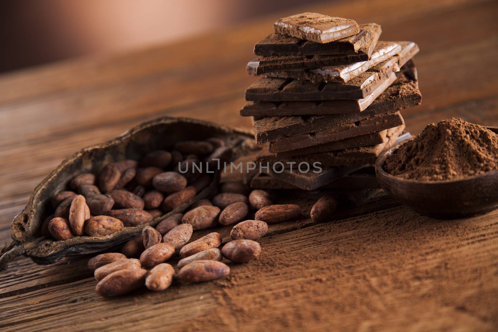 Dark and milk chocolate bar on a wooden table