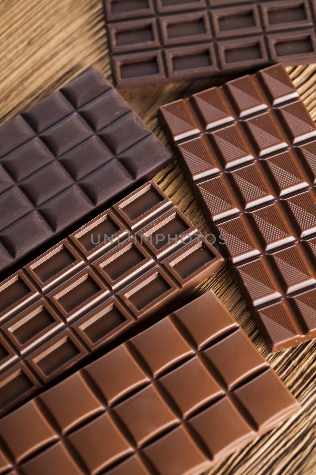 Bars Chocolate , candy sweet, dessert food on wooden background by JanPietruszka