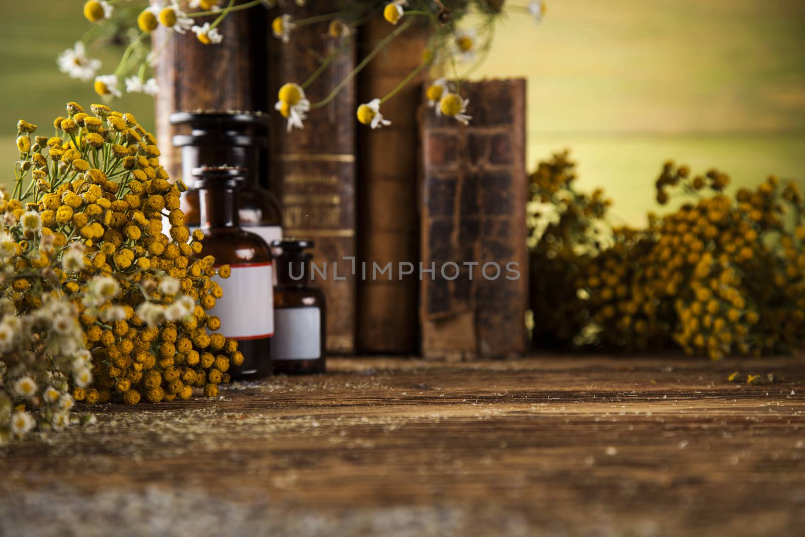 Book and Herbal medicine on wooden table background