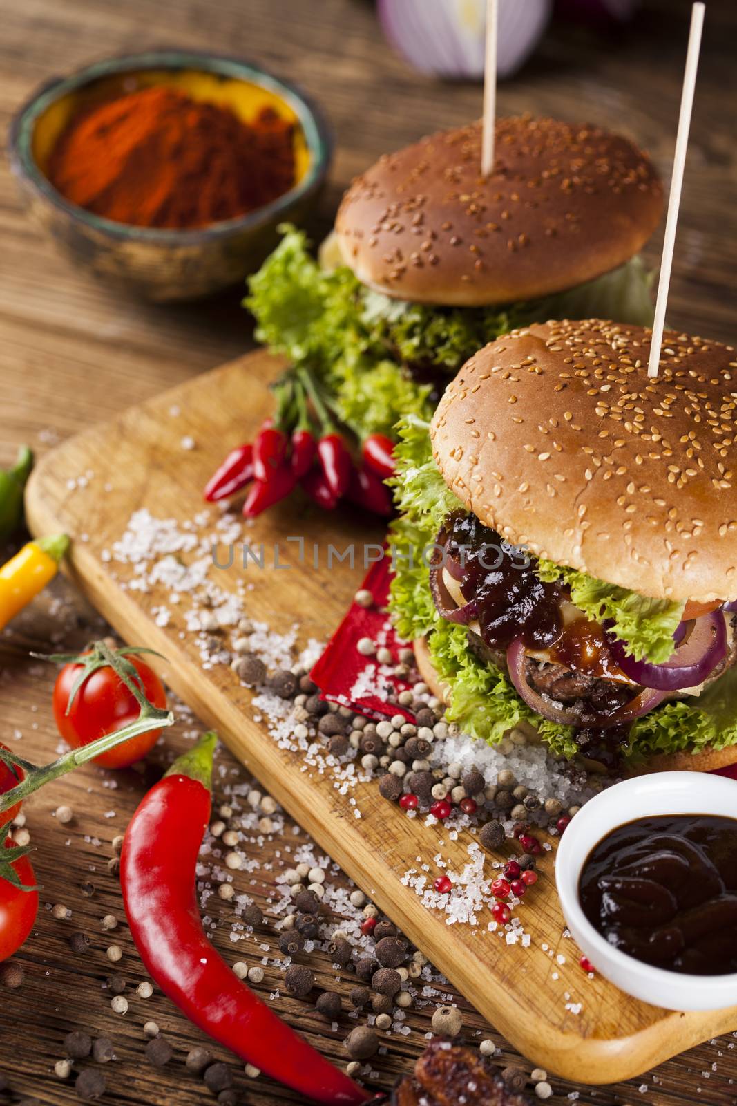 Fast food hamburge, wooden desk background