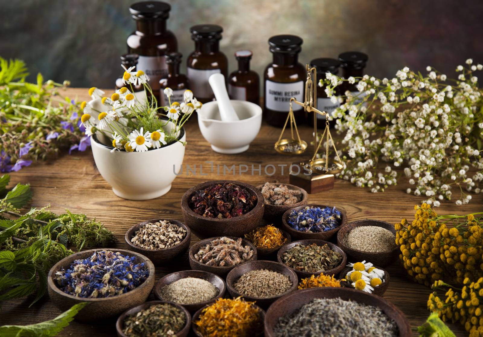 Healing herbs on wooden table, mortar and herbal medicine