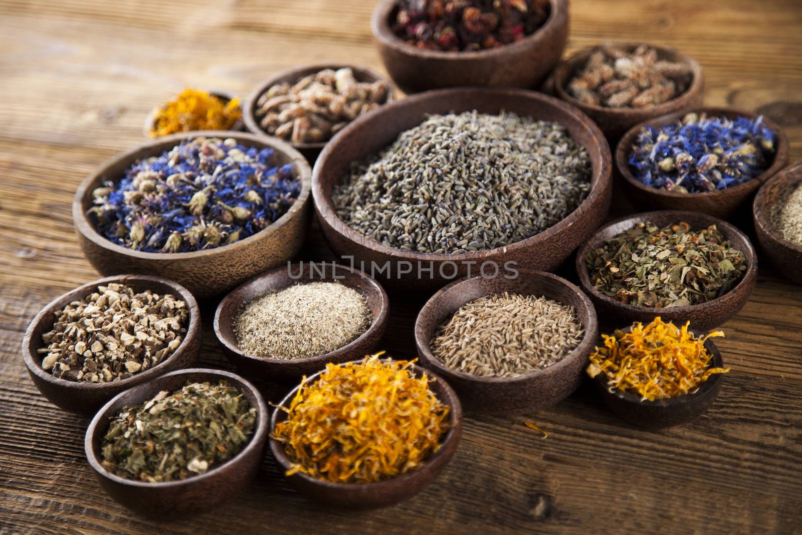 Herbal medicine on wooden desk background by JanPietruszka