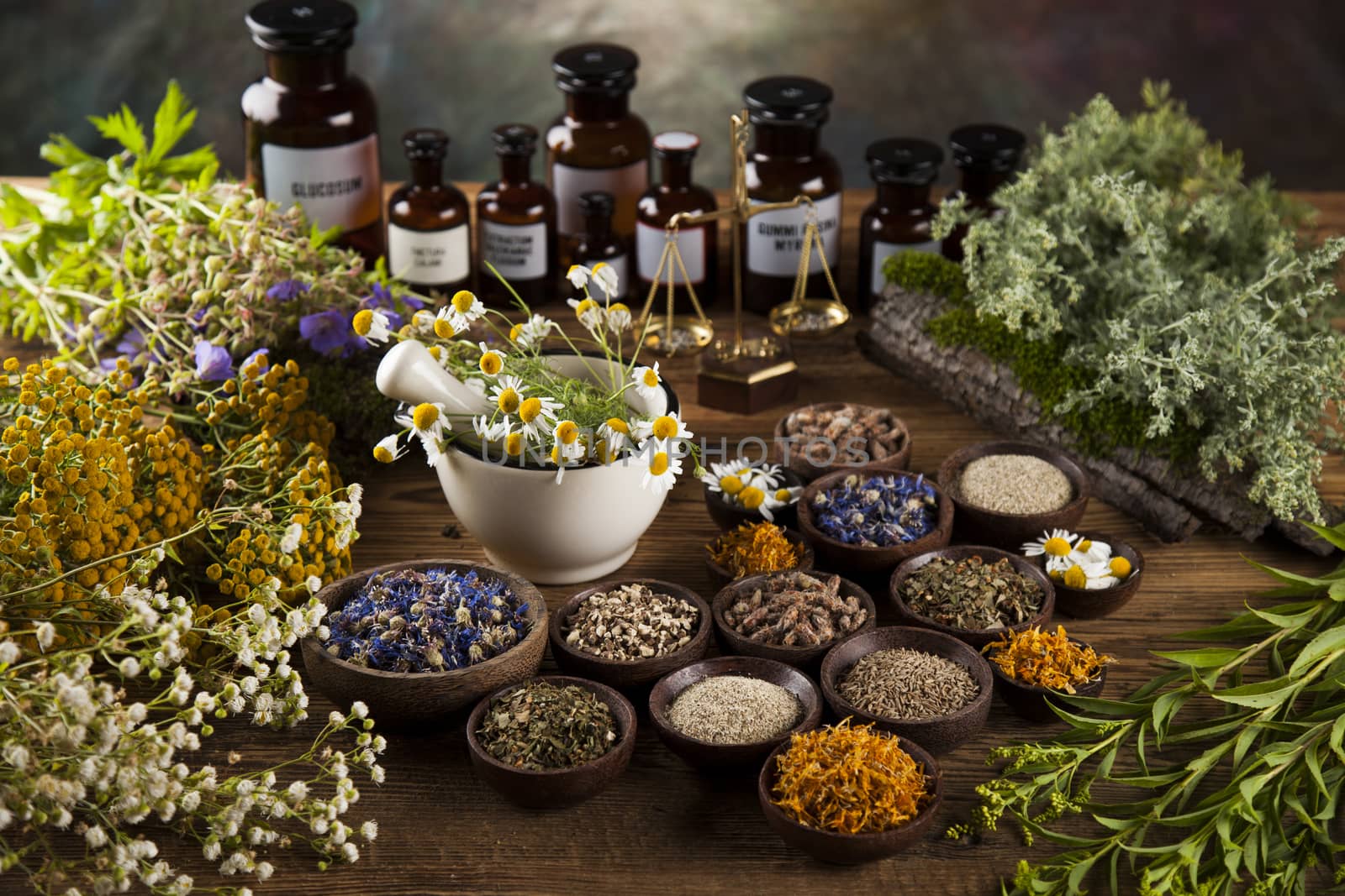 Natural medicine on wooden table background by JanPietruszka