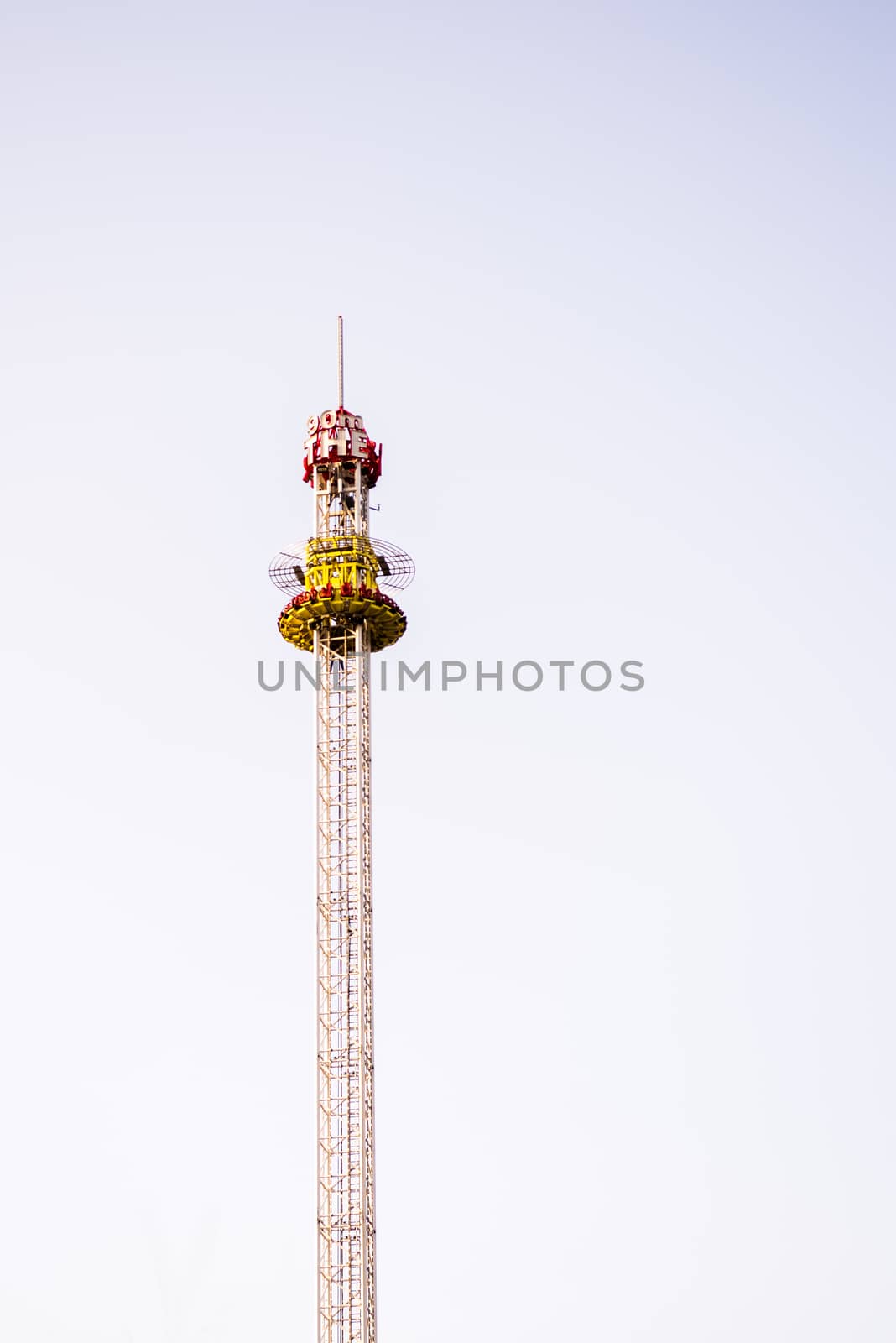 Amusement park ride, meerry go round, carousel ride on extremly high tower