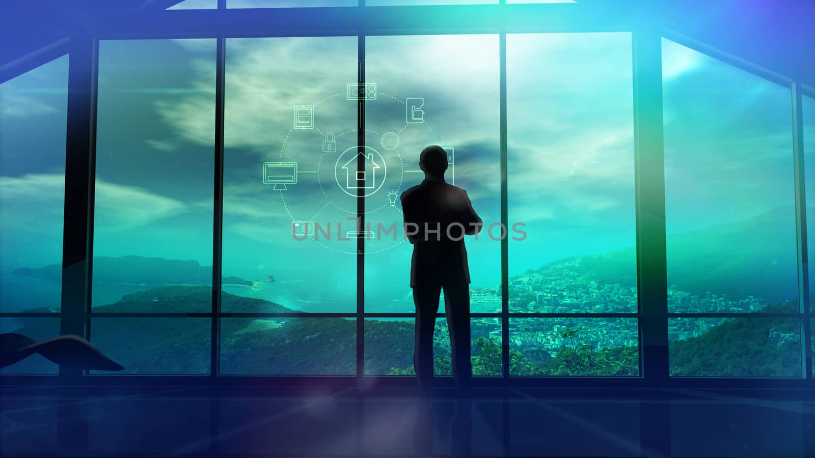 Silhouette of a man in a huge office in front of large windows.