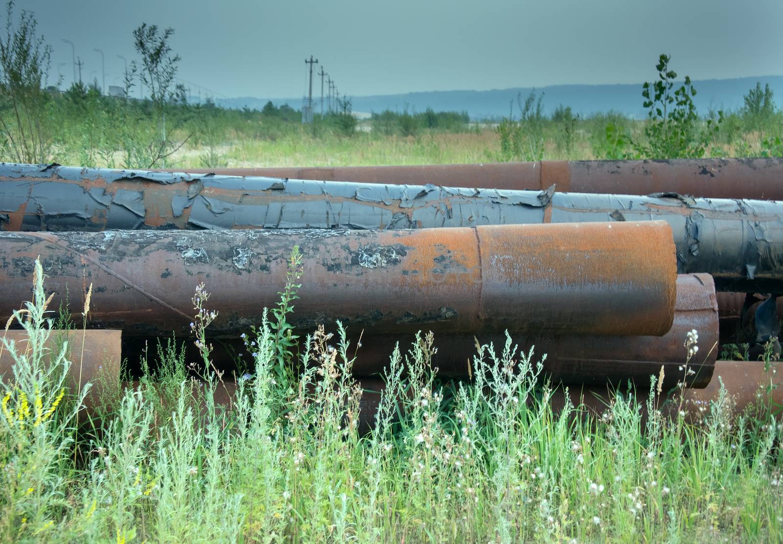 pipe engineering construction on sand. warehouse large pipes under open sky