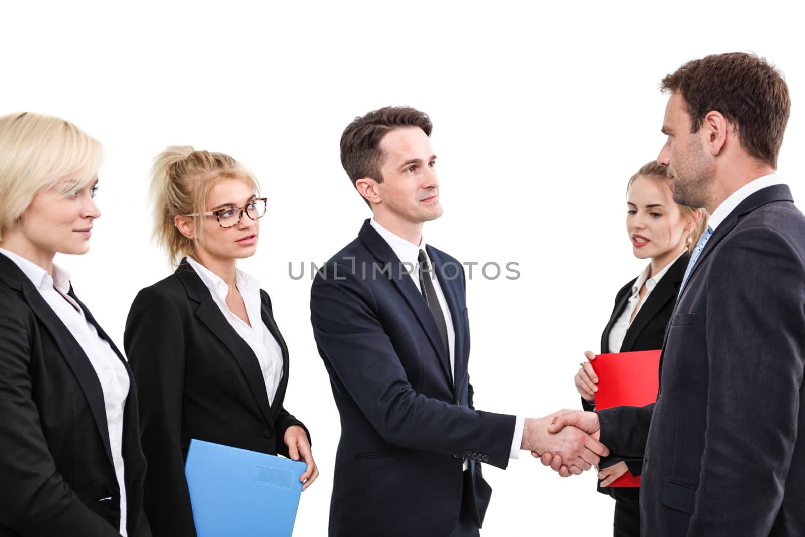 Business people shaking hands, finishing up a meeting, isolated on white background