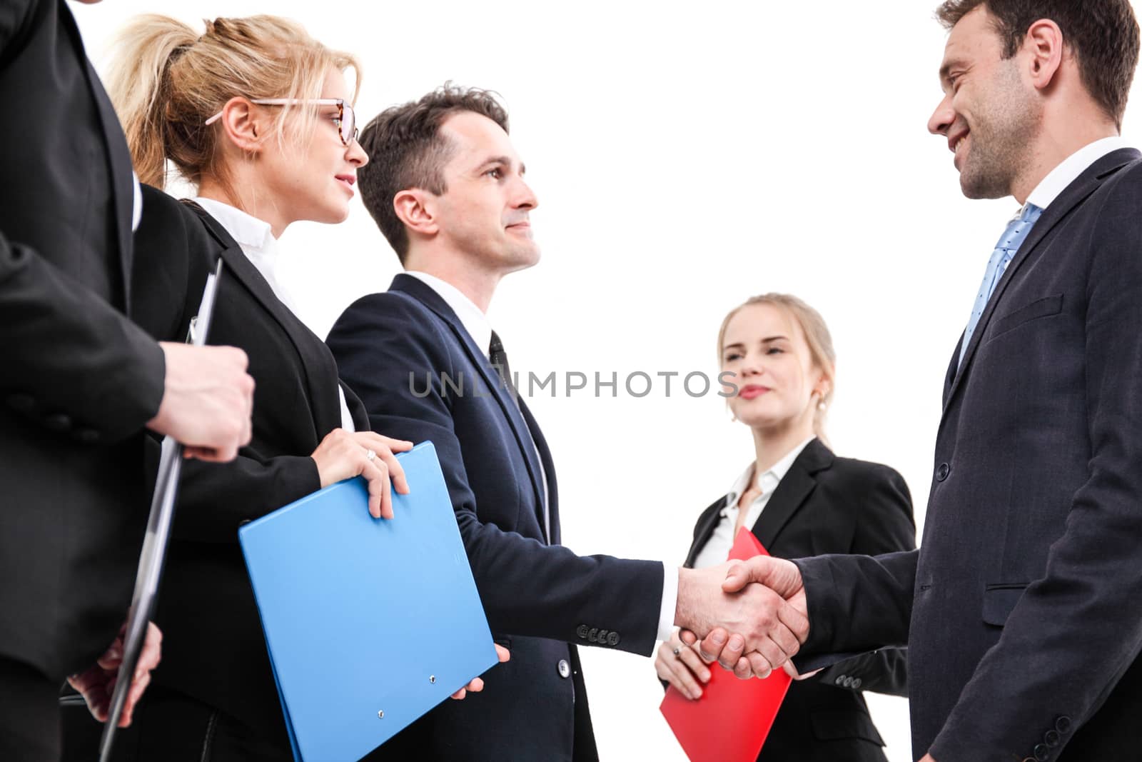 Business people shaking hands by ALotOfPeople