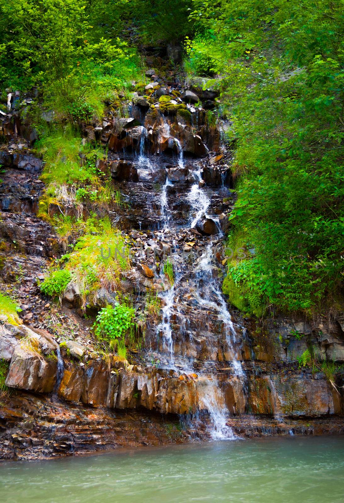 small waterfall in forest by Pellinni