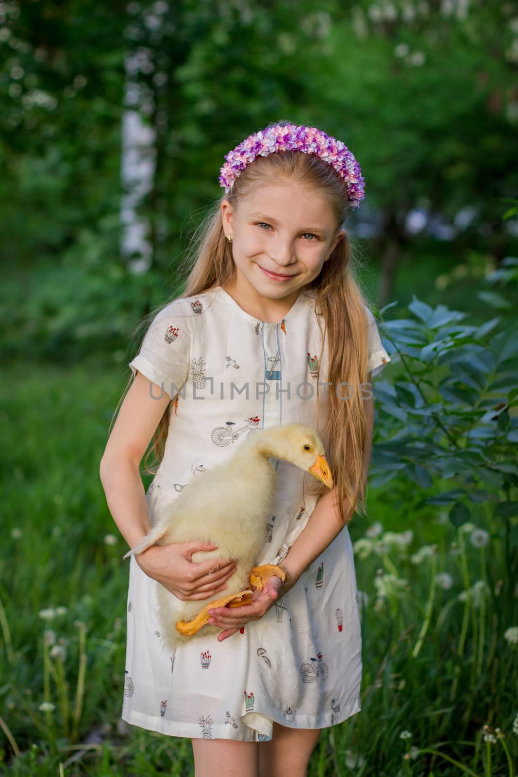 girl in wreath having fun with duckling by Angel_a