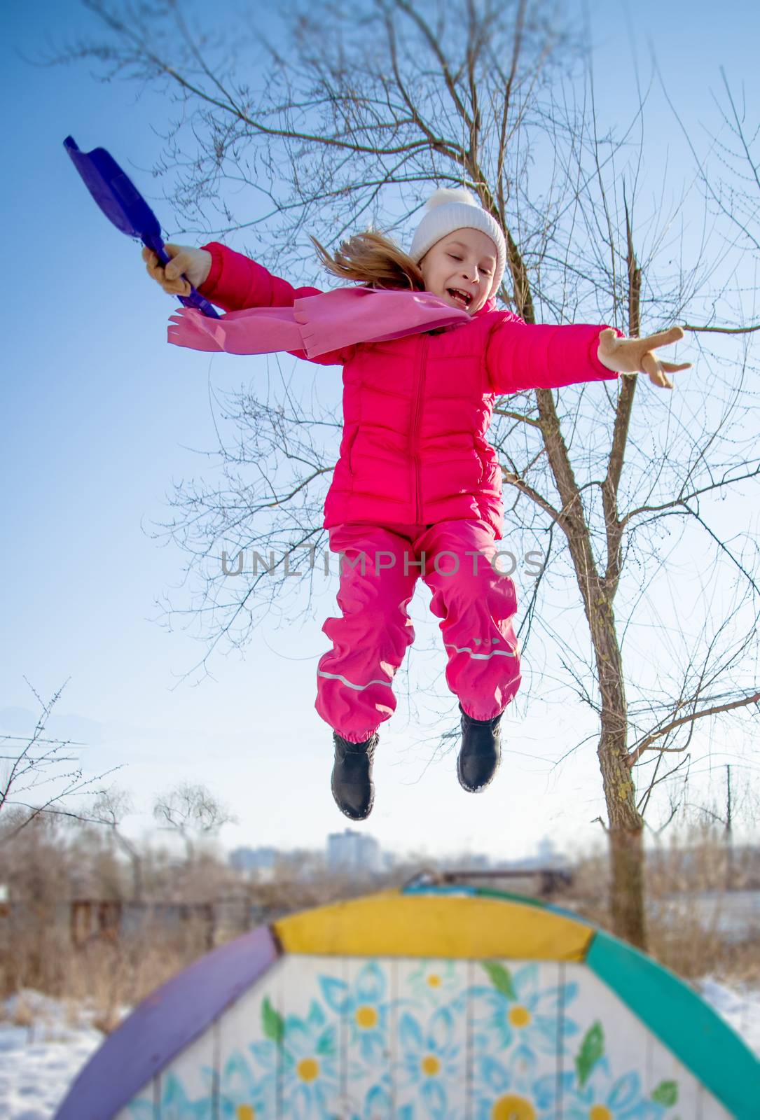 Girl jumping in winter