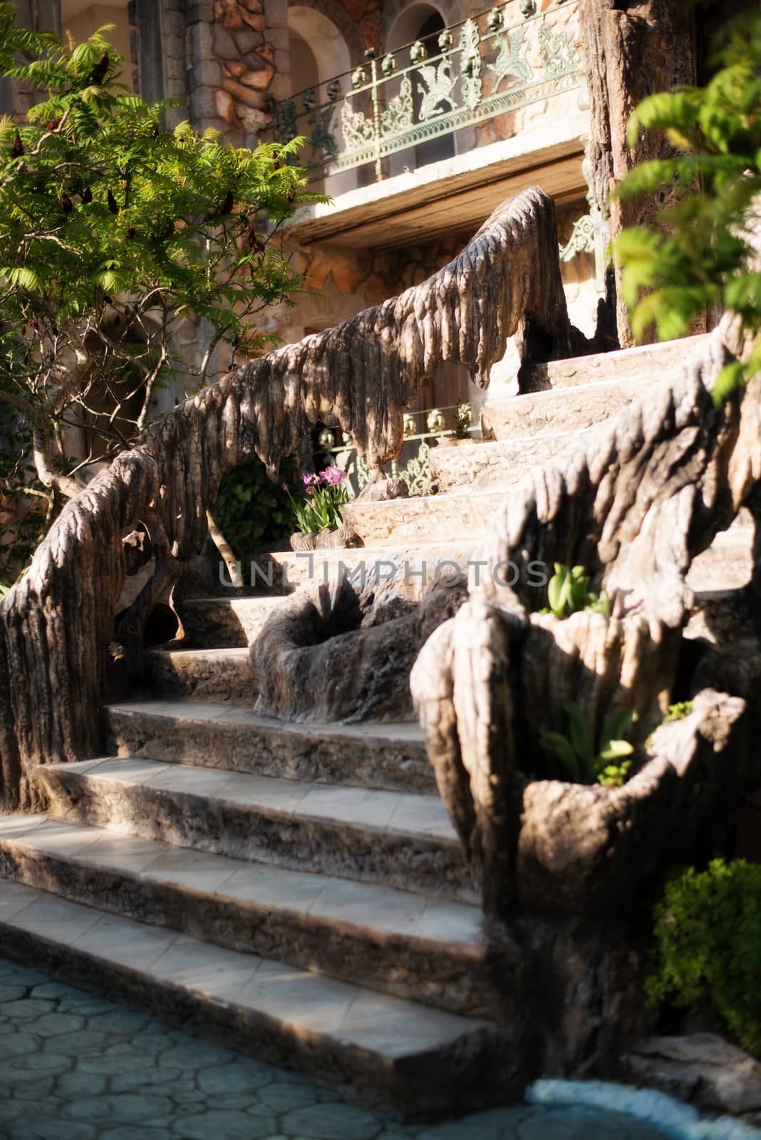 Old baroque stairs, outdoors. Stairs made of stone, small fountain with running water in the middle