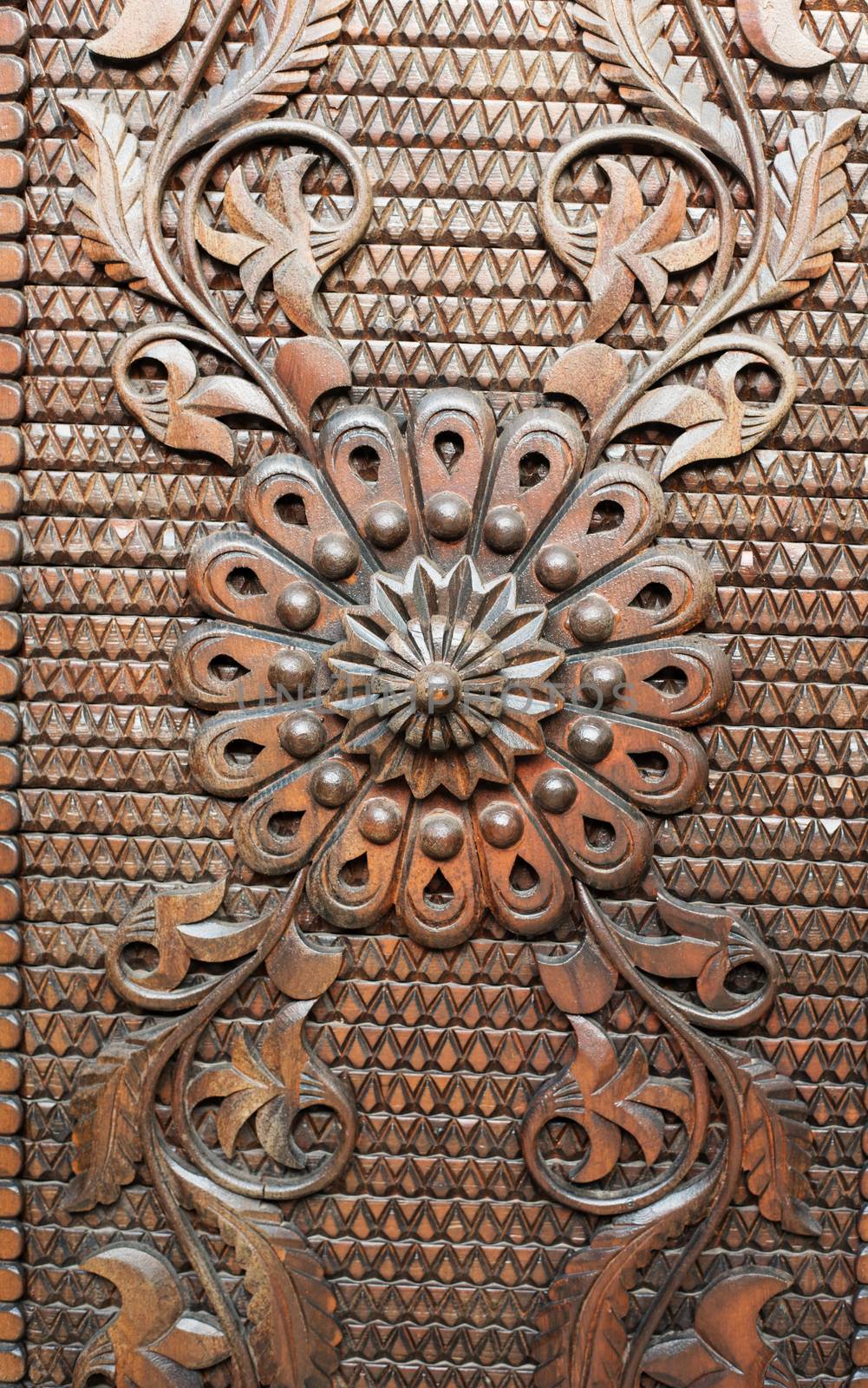 Detail from an old iron metal door. Close - up of ornament. Texture, background