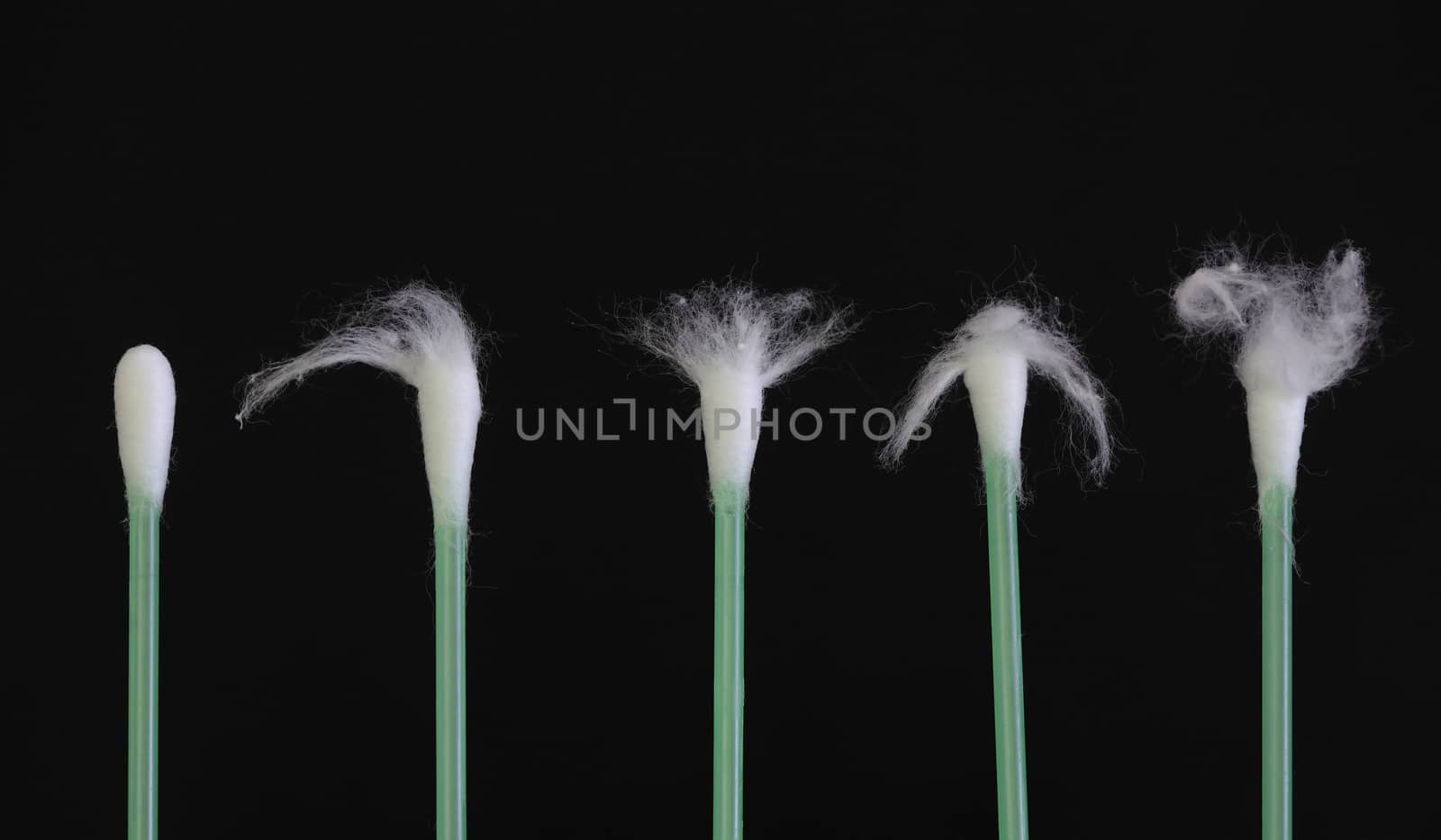 Green cotton swabs - Hairdresser Cutting Client's Hair