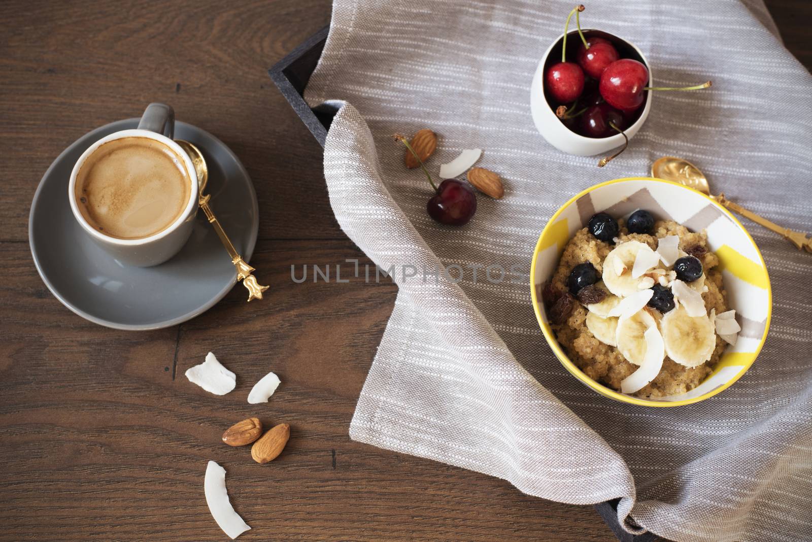 Almond Milk Quinoa With Fresh Fruits, Cherries And Coffee in a Tray. Healthy Breakfast, Lifestyle Concept. Top View. Dark Wooden Background. Fitness Mood Diet. Summer Light Snack by sevda_stancheva