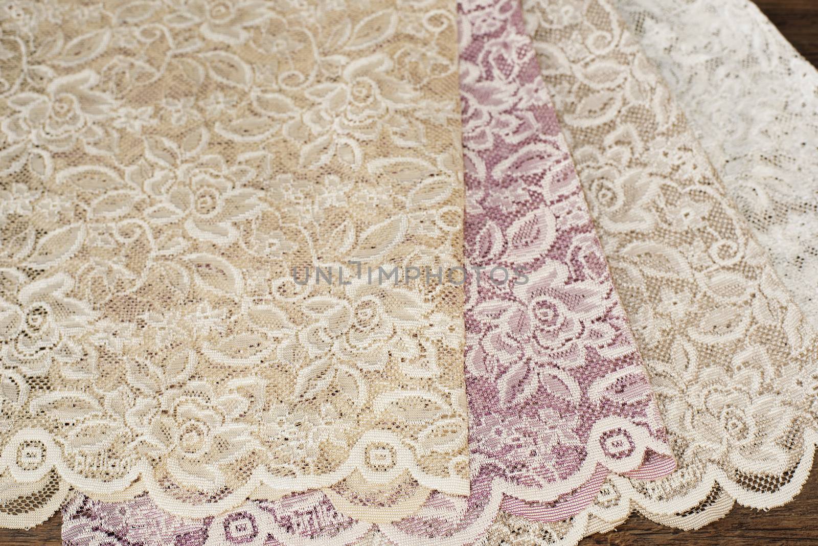 Close up of Beautiful Sheer Curtains Fabric Samples. Texture, Background, Pattern. Wedding Concept. Interior Design. Vintage Lace Tulle Chiffon ? White, Purple, Beige by sevda_stancheva