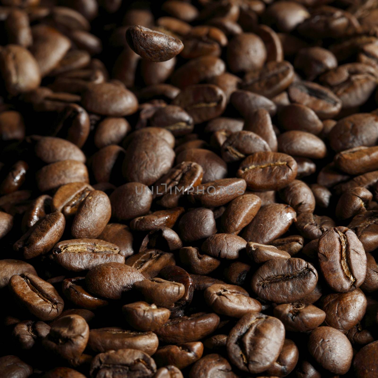 Fresh roasted coffee beans close-up background