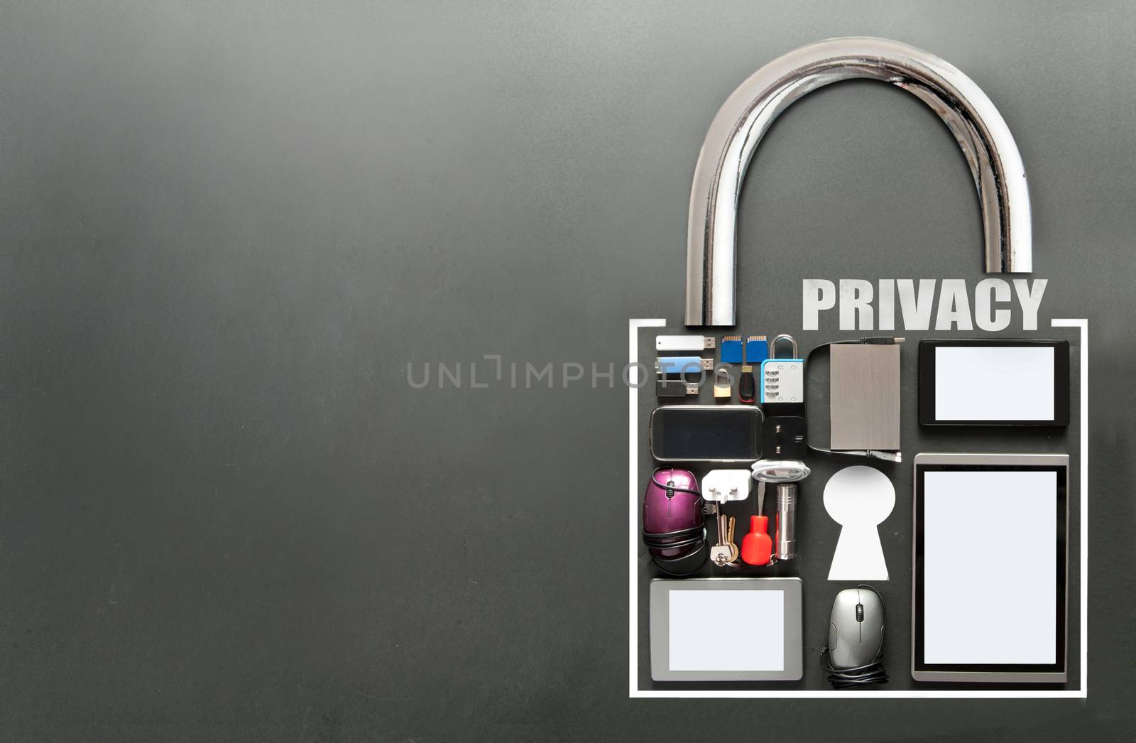 Online privacy, various devices including tablets, computer mouse, usb cards in the shape of a padlock on a chalkboard background