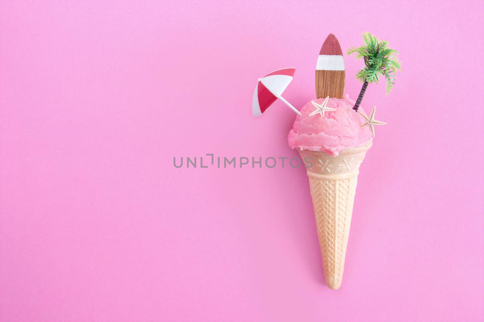 Strawberry icecream with parasol, surfboard and pine tree