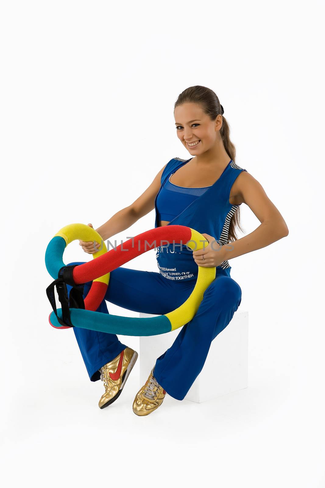 Young woman and training device on isolated background