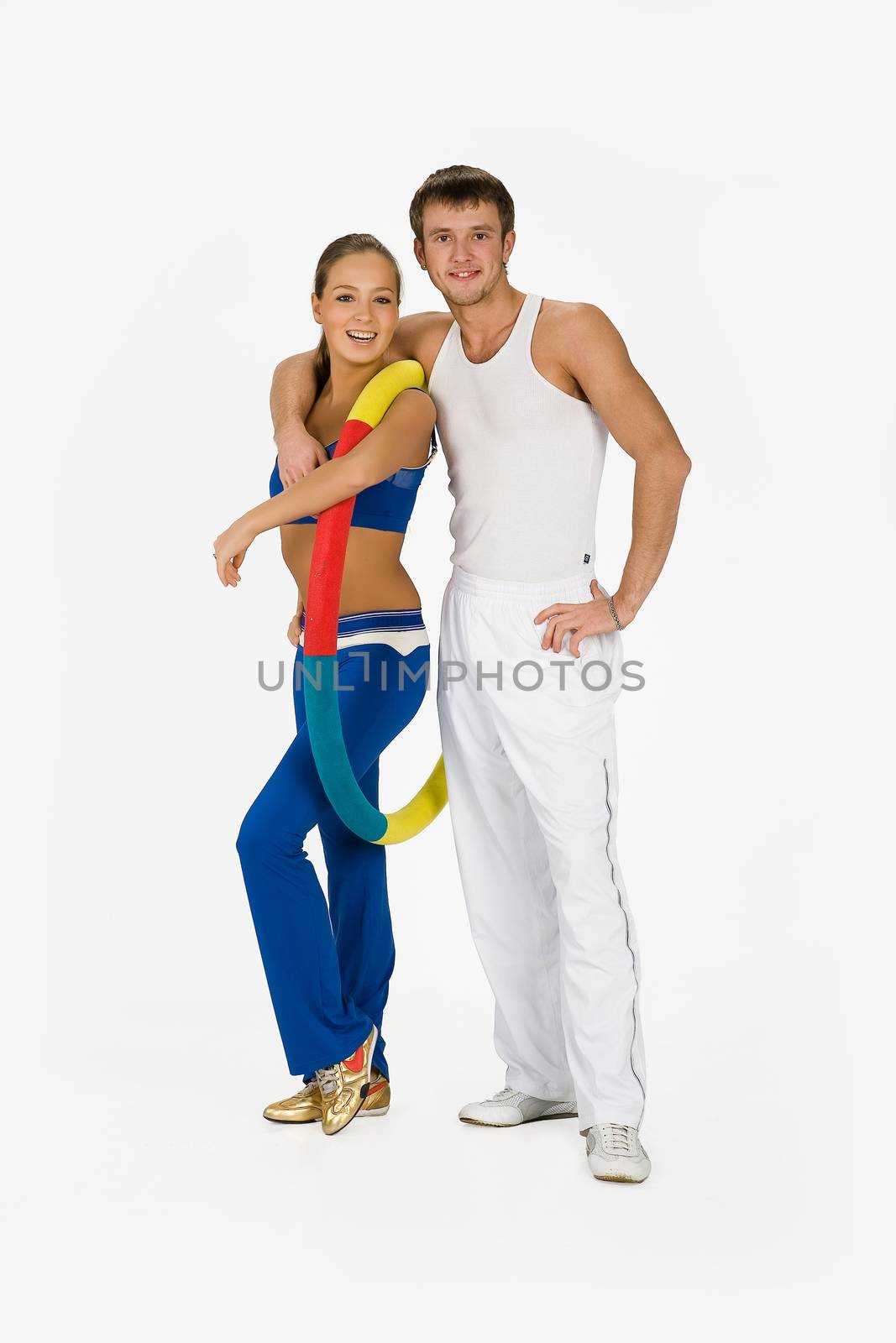 Young woman and man with the training device on isolated background