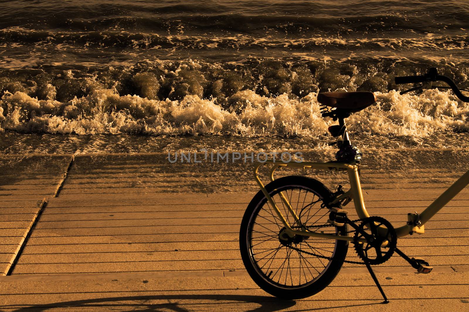 bicycle on the seashore in sepia style by lovecomunication