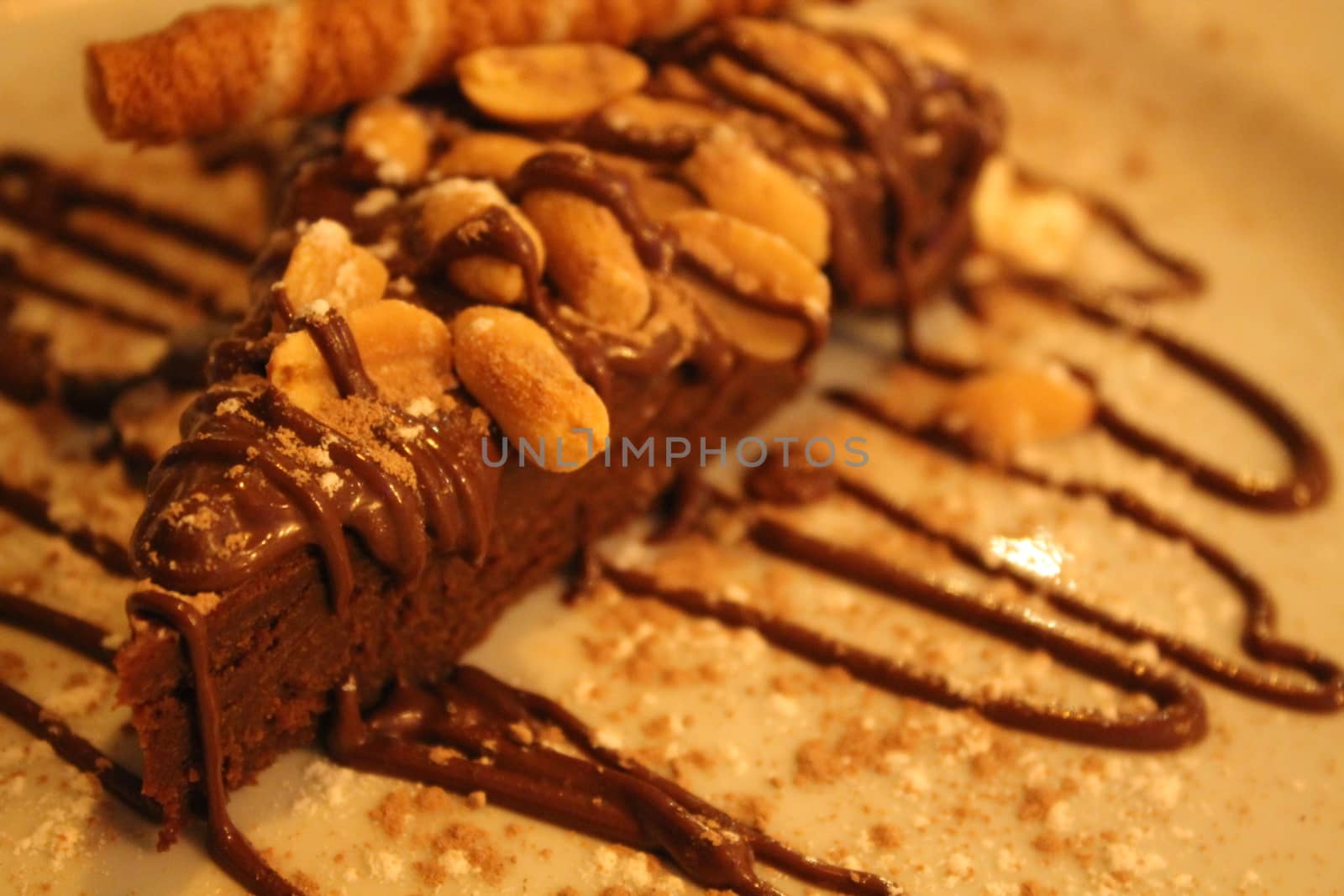 Chocolate cake with peanuts and topping