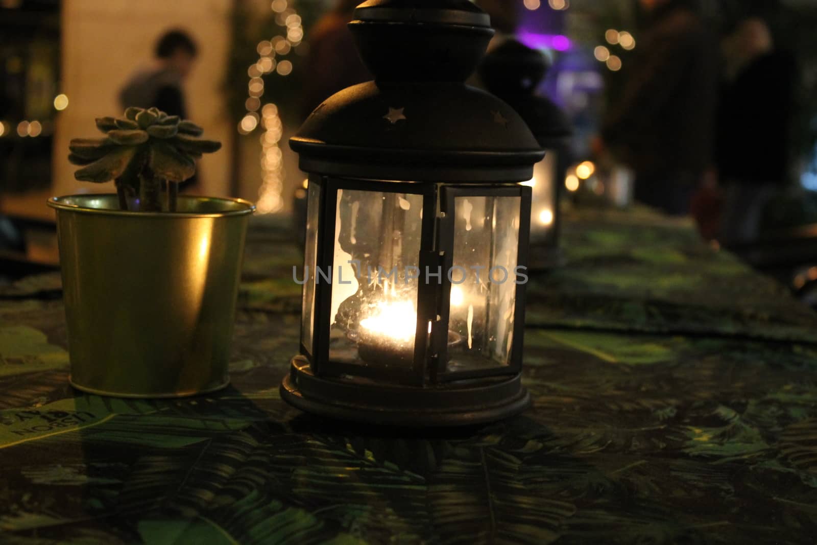 green lantern with candle inside by lovecomunication