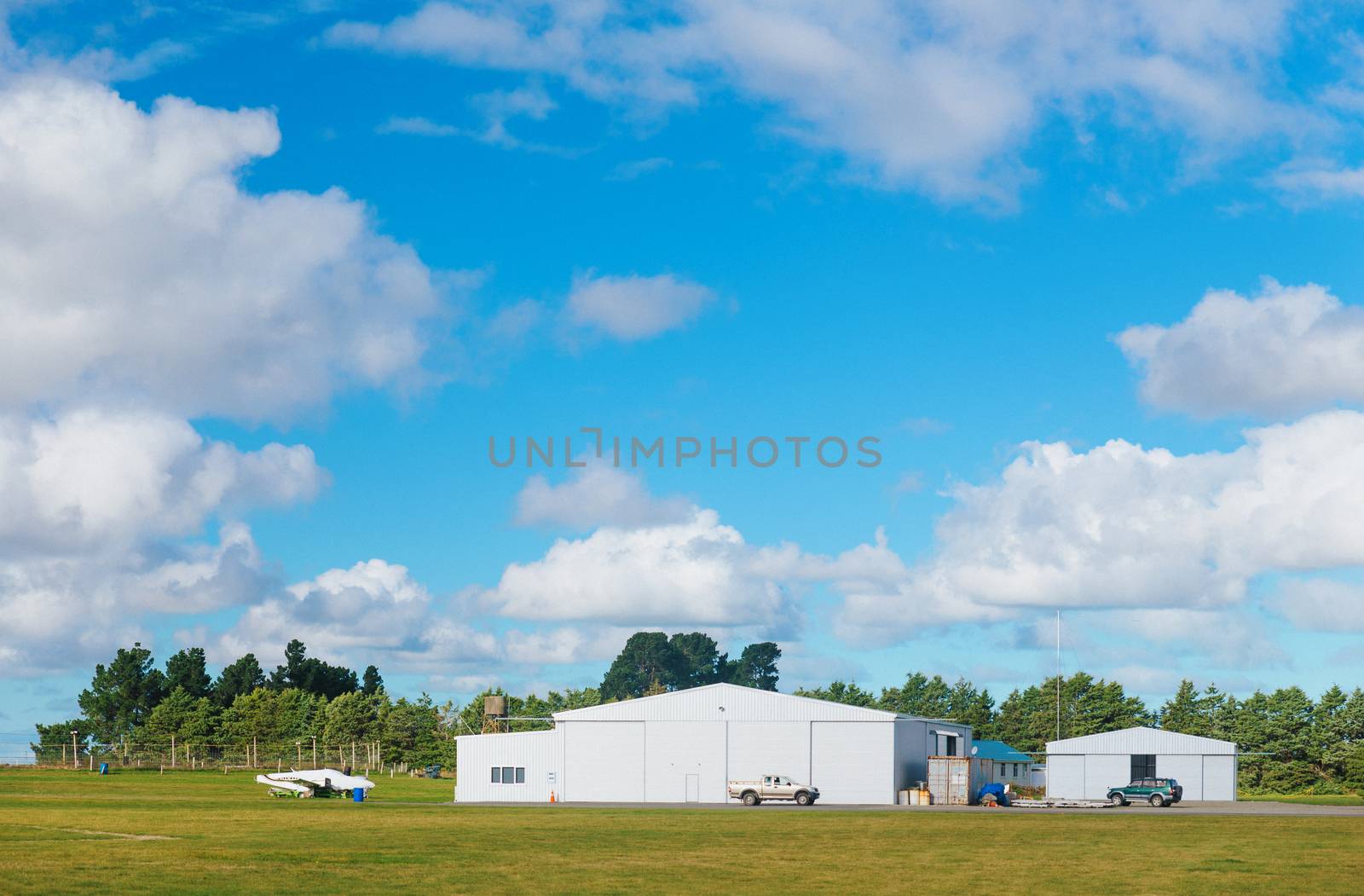 Metallic warehouse with blue sky by cozyta